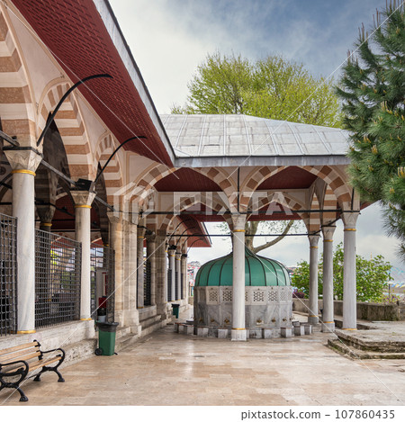 White marble decorated ablution fountain in the courtyard of the Mihrimah Sultan Mosque in Uskudar, Istanbul, Turkey 107860435