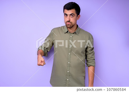 Young serious bearded deaf mute man showing the word shop, mall Young serious bearded deaf mute man showing the word shop, mall 107860584