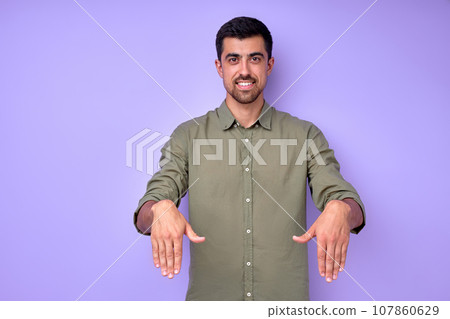Young cheerful happy deaf mute man saying the word son Young cheerful happy deaf mute man saying the word son 107860629