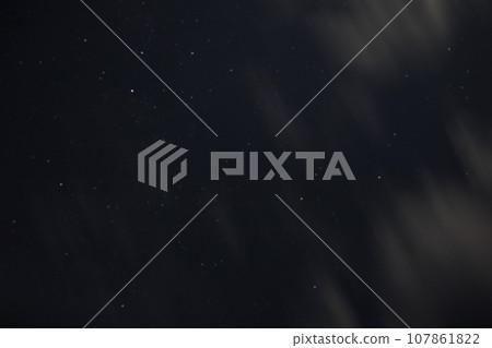 clouds flowing in the starry sky 107861822