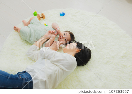 Family in the living room baby 107863967
