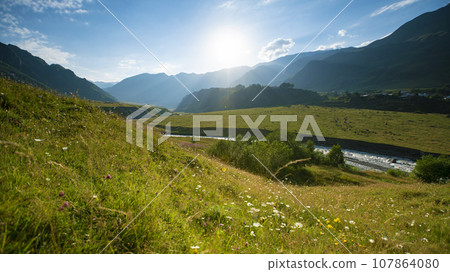 Beautiful view of the mountains illuminated by the sun in summer. Georgia, Europe. Caucasus mountains. 107864080