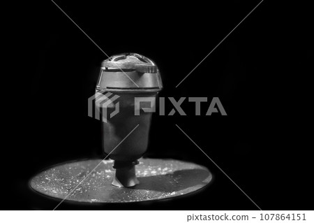 Hookah clay bowl close-up grey smoking object on a dark background Hookah clay bowl close-up grey smoking object on a dark background 107864151