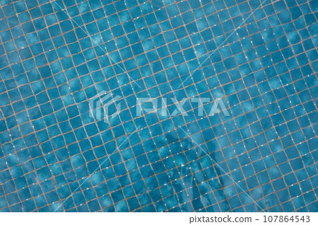 Close up of blue pool tiles Close up of blue pool tiles 107864543
