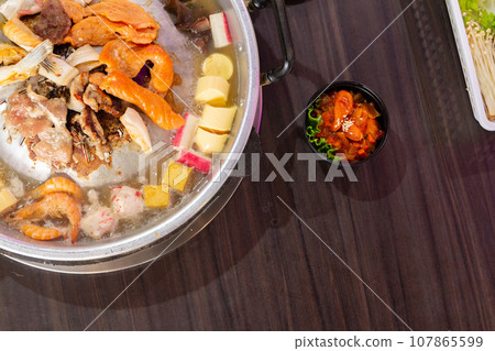 Close up of pook bbq Thai food style. shabu sukiyaki or Moo-Ka-Ta griiled pork. Free space for texting. 107865599