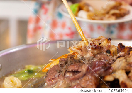 Close up of Thai food style. shabu sukiyaki or Moo-Ka-Ta griiled pork. Close up of Thai food style. shabu sukiyaki or Moo-Ka-Ta griiled pork. 107865604