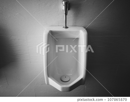 Close up of urinal men public toilet, Closeup white urinal in men's bathroom Close up of urinal men public toilet, Closeup white urinal in men's bathroom 107865870