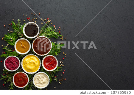 Sauces in bowls with seasonings 107865980