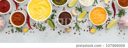 Different types of sauces in bowls 107866008