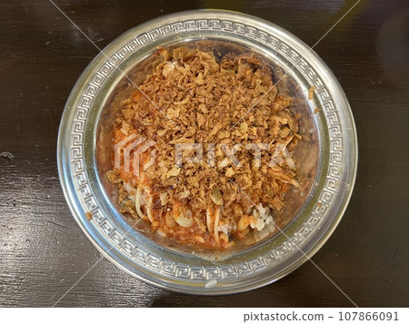 Egyptian food Koshari served on a silver plate 107866091