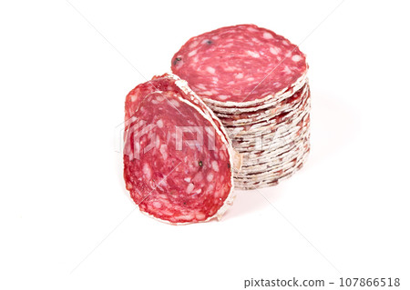 Slices of salami sausage on a white background 107866518
