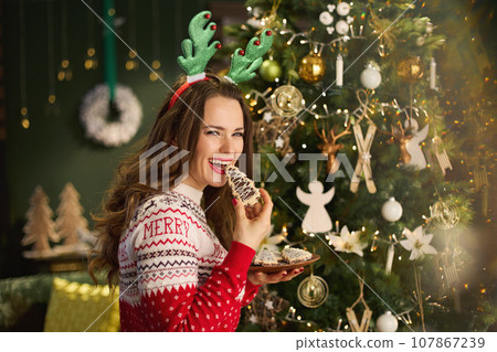 smiling trendy female at modern home 107867239