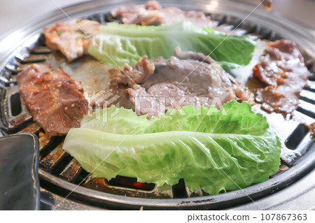 grilled pork , grilled beef and vegetable in the oven 107867363