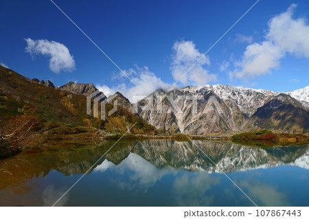 Northern Alps reflected in Happo Pond 107867443