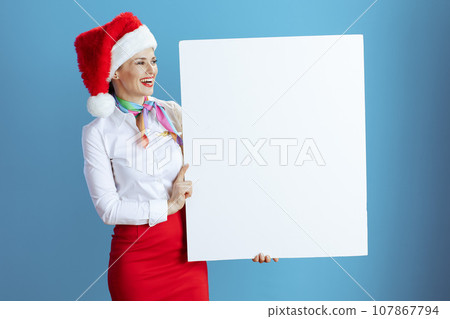 happy modern stewardess woman on blue showing blank board happy modern stewardess woman on blue showing blank board 107867794