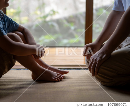 child doing physical education sitting 107869071