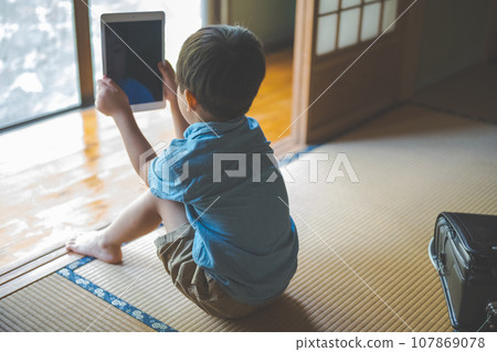 Elementary school students and tablets Elementary school students and tablets 107869078