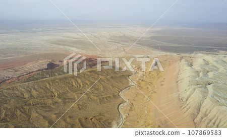 Colorful high mountains and a canyon made of clay 107869583