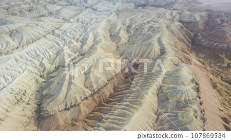 Colorful high mountains and a canyon made of clay 107869584
