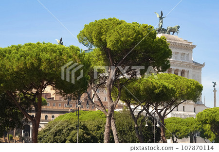 Monument to Victor Emmanuel II or Vittoriano, Rome, Italy. It is landmark of Rome. Beautiful view of Memorial of Vittorio Emanuele in sunset light. 107870114