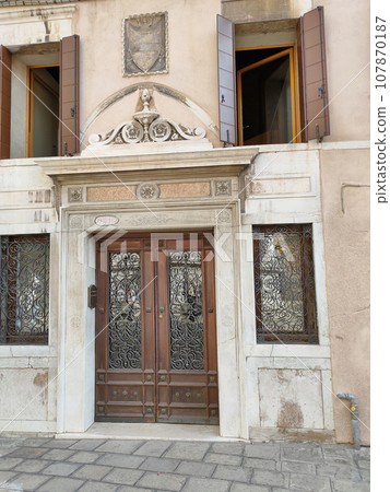 Facades of historic buildings in the city center. 107870187