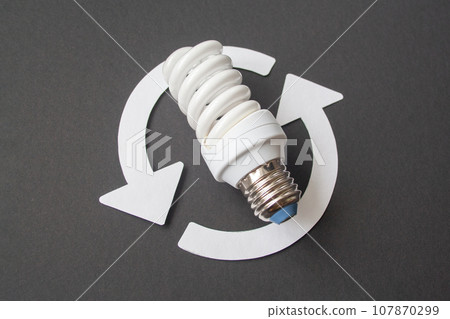 Energy saving light bulb on a black background Energy saving light bulb on a black background 107870299
