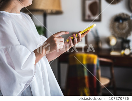 Woman with smartphone Woman with smartphone 107870786