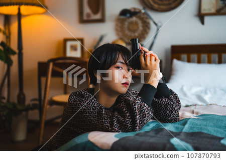 portrait of a woman with a gun 107870793