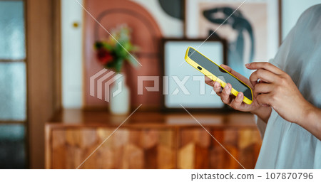 Woman with smartphone 107870796