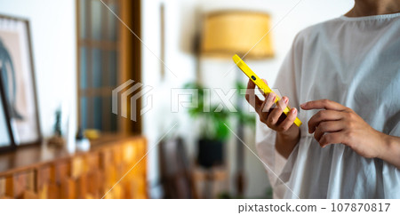 Woman with smartphone 107870817