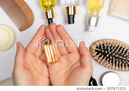 Natural oil for hair or skin care in glass jar. Eco-friendly cosmetics without plastic 107871525