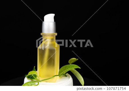 Natural oil for hair or skin care in glass jar. Eco-friendly cosmetics without plastic Natural oil for hair or skin care in glass jar. Eco-friendly cosmetics without plastic 107871754