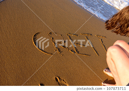 the word crete written in the sand at the water's edge the word crete written in the sand at the water's edge 107873711