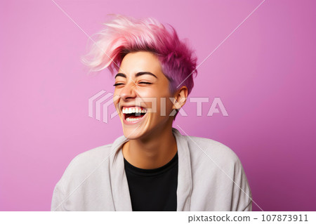 Laughing Genderqueer Person on Pink Backdrop 107873911