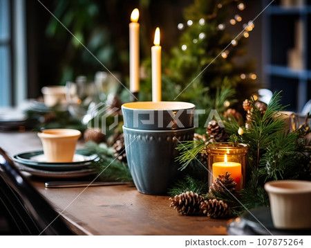 Winter holiday season festive dining table decoration with candles and beautiful tableware, elegant table decor Winter holiday season festive dining table decoration with candles and beautiful tableware, elegant table decor 107875264