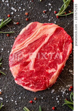 Uncooked rib eye steak 107875285