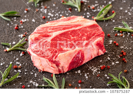 Uncooked rib eye steak 107875287