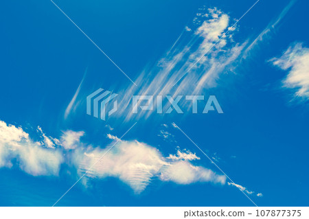 Streak clouds that appear in the autumn blue sky b-4 Warm colors added Streak clouds that appear in the autumn blue sky b-4 Warm colors added 107877375
