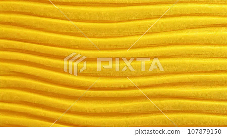 Yellow abstract wavy background. Yellow fabric texture. 107879150