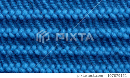 Blue knitted texture. Knitted woolen texture. Woolen background. Knitted texture. Close-up. 107879151