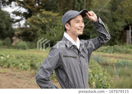 Farmer man with field and smile 107879515