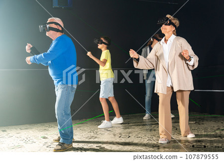 Family playing VR games together Family playing VR games together 107879555