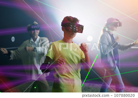 Boy playing VR games with his family Boy playing VR games with his family 107880020