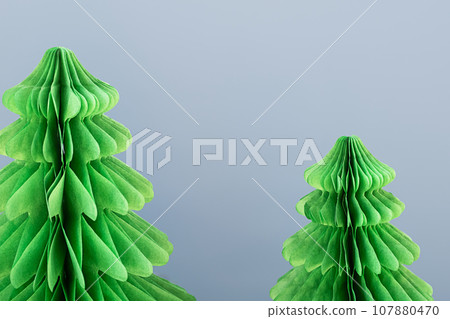 Trend paper Christmas trees. DIY alternative Christmas decoration, close up. 107880470