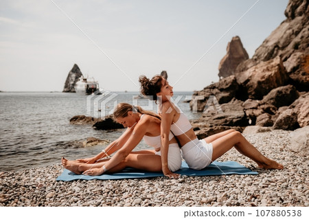 Woman In Yoga Pose On The Beach Stock Photo - Alamy