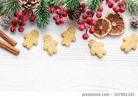 Christmas gifts, gingerbread cookies, decorations with christmas tree. 107882181