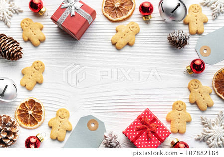 Christmas gifts, gingerbread cookies, decorations with christmas tree. Christmas gifts, gingerbread cookies, decorations with christmas tree. 107882183