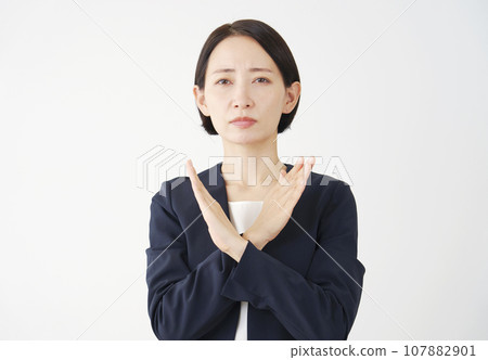 Business woman posing with a mark on her arm, white background Business woman posing with a mark on her arm, white background 107882901