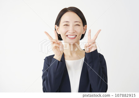 Business woman making peace sign with both hands, white background Business woman making peace sign with both hands, white background 107882915