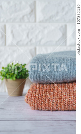 Folded winter clothes | Laundry / change of clothes image Folded winter clothes | Laundry / change of clothes image 107883156